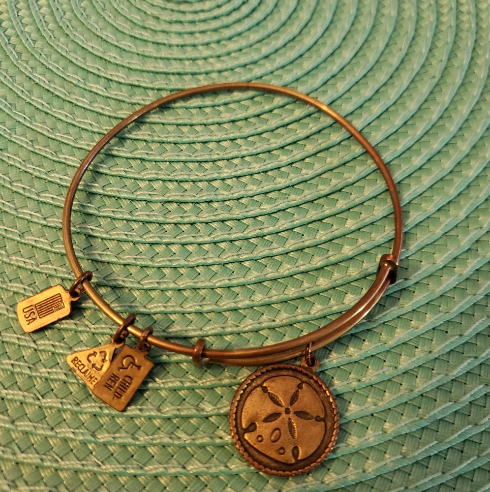 Brass Wind and Fire sand dollar bracelet.